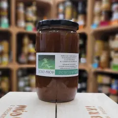 Słoik ziołomiodu pokrzywowego, wytwarzanego przez pszczoły z pożywki na bazie naturalnego soku z liści pokrzywy.