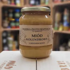 Słoik miodu kolendrowego. Dowiedz się, jak stosować miód na żołądek dla ulgi i zdrowia. Naturalny produkt z polskiej pasieki.