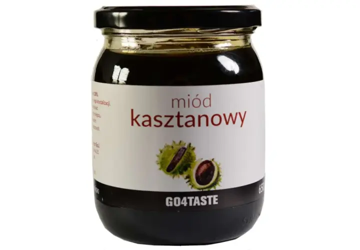 Słoik ciemnego miodu kasztanowego z etykietą przedstawiającą owoce kasztanowca. Poznaj jego niezwykłe miód kasztanowy właściwości.