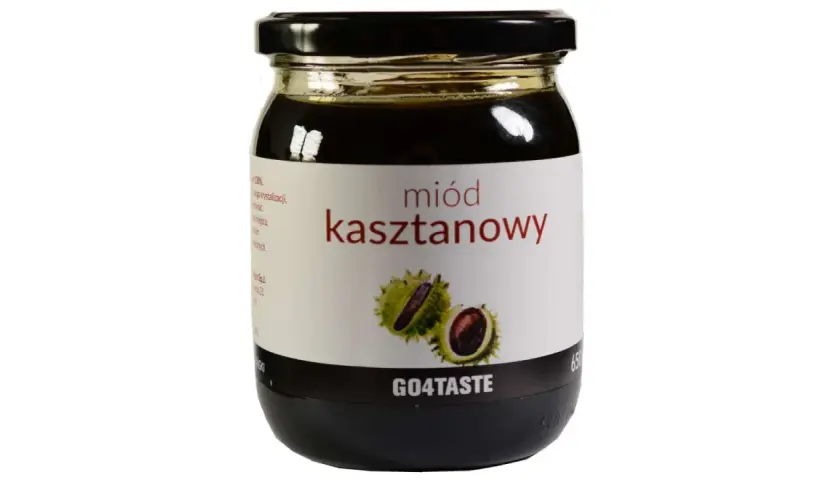 Słoik ciemnego miodu kasztanowego z etykietą przedstawiającą owoce kasztanowca. Poznaj jego niezwykłe miód kasztanowy właściwości.